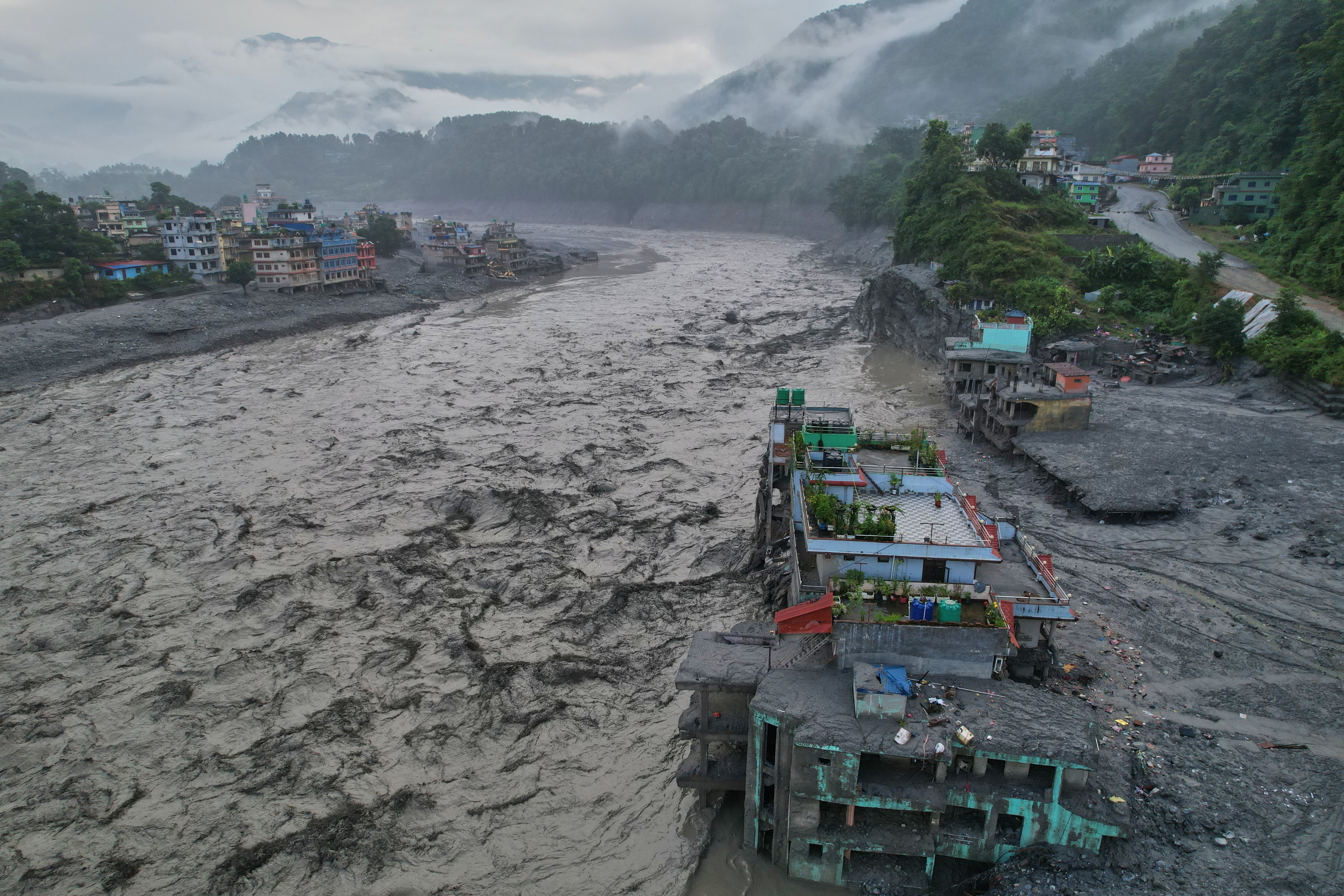 A drone view shows the aftermath of flash flooding along the Trishuli River amid a freshwater surge warning in the Trishuli Bazaar area of Nuwakot district in Nepal on Sunday.